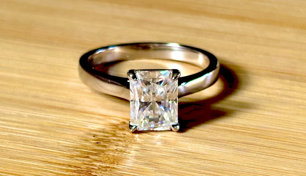 A certified Moissanite 3ct radiant solitaire! An UBER flashy, ULTRA classy, contemporary and chic radiant-cut engagement ring!