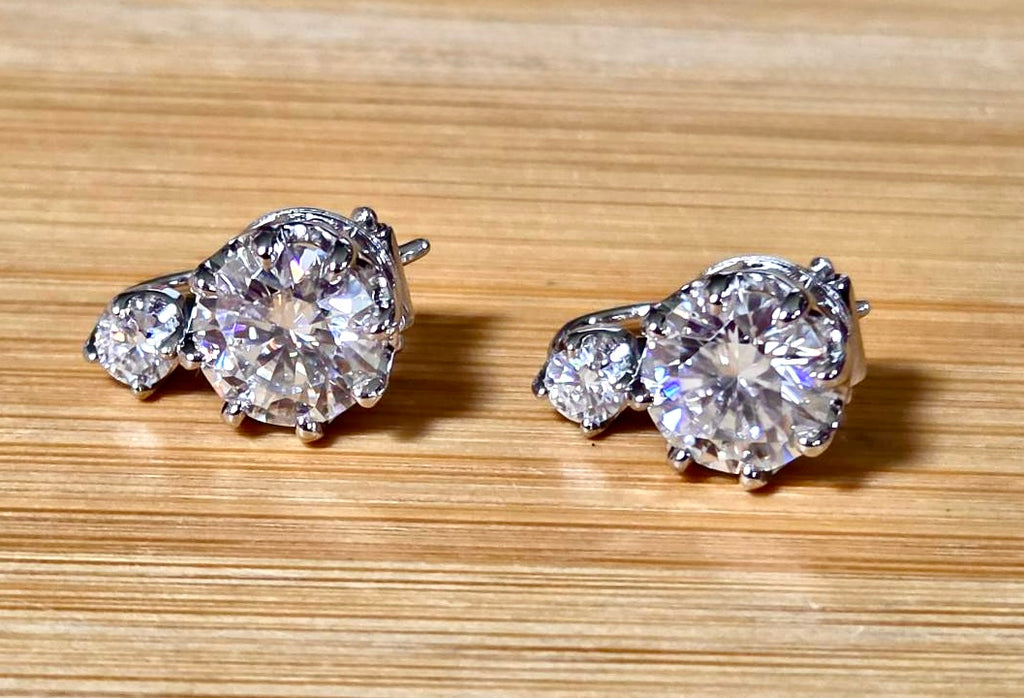 A Victorian inspired 4.2cttw certified pair of Moissanite 2-stone buckle back earrings in Argentium silver! Minimalist glam!