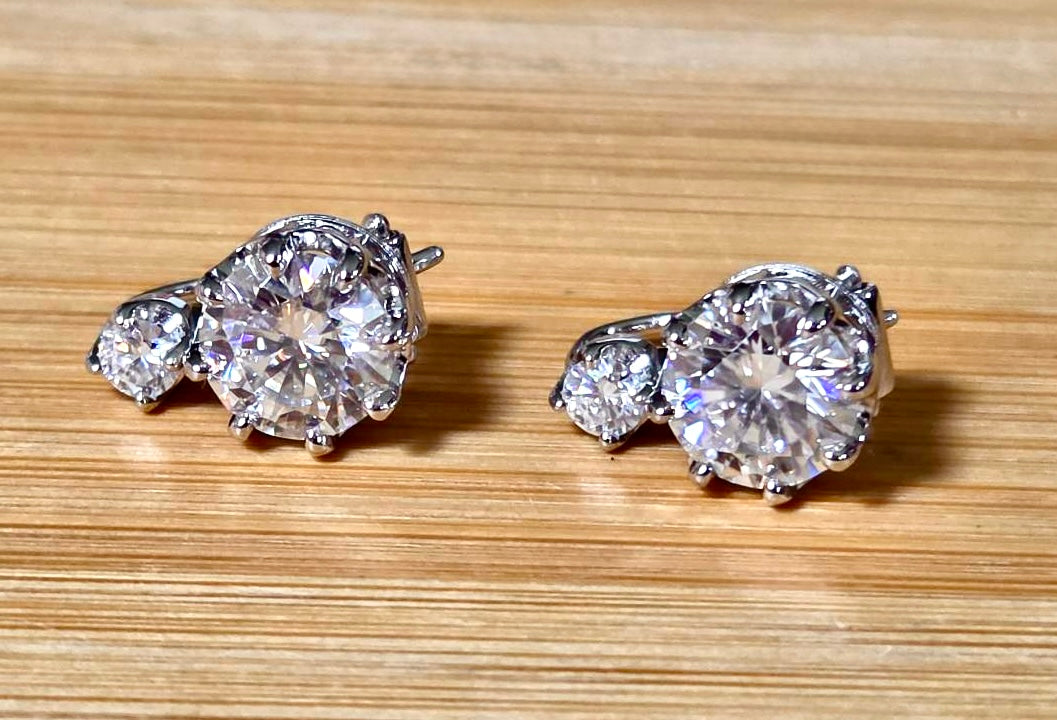 A Victorian inspired 4.2cttw certified pair of Moissanite 2-stone buckle back earrings in Argentium silver! Minimalist glam!