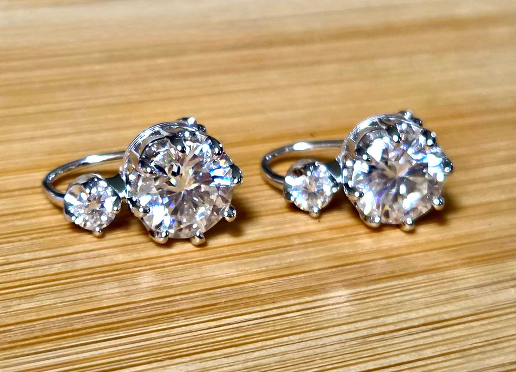A Victorian inspired 4.2cttw certified pair of Moissanite 2-stone buckle back earrings in Argentium silver! Minimalist glam!