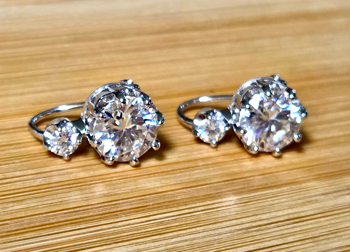 A Victorian inspired 4.2cttw certified pair of Moissanite 2-stone buckle back earrings in Argentium silver! Minimalist glam!