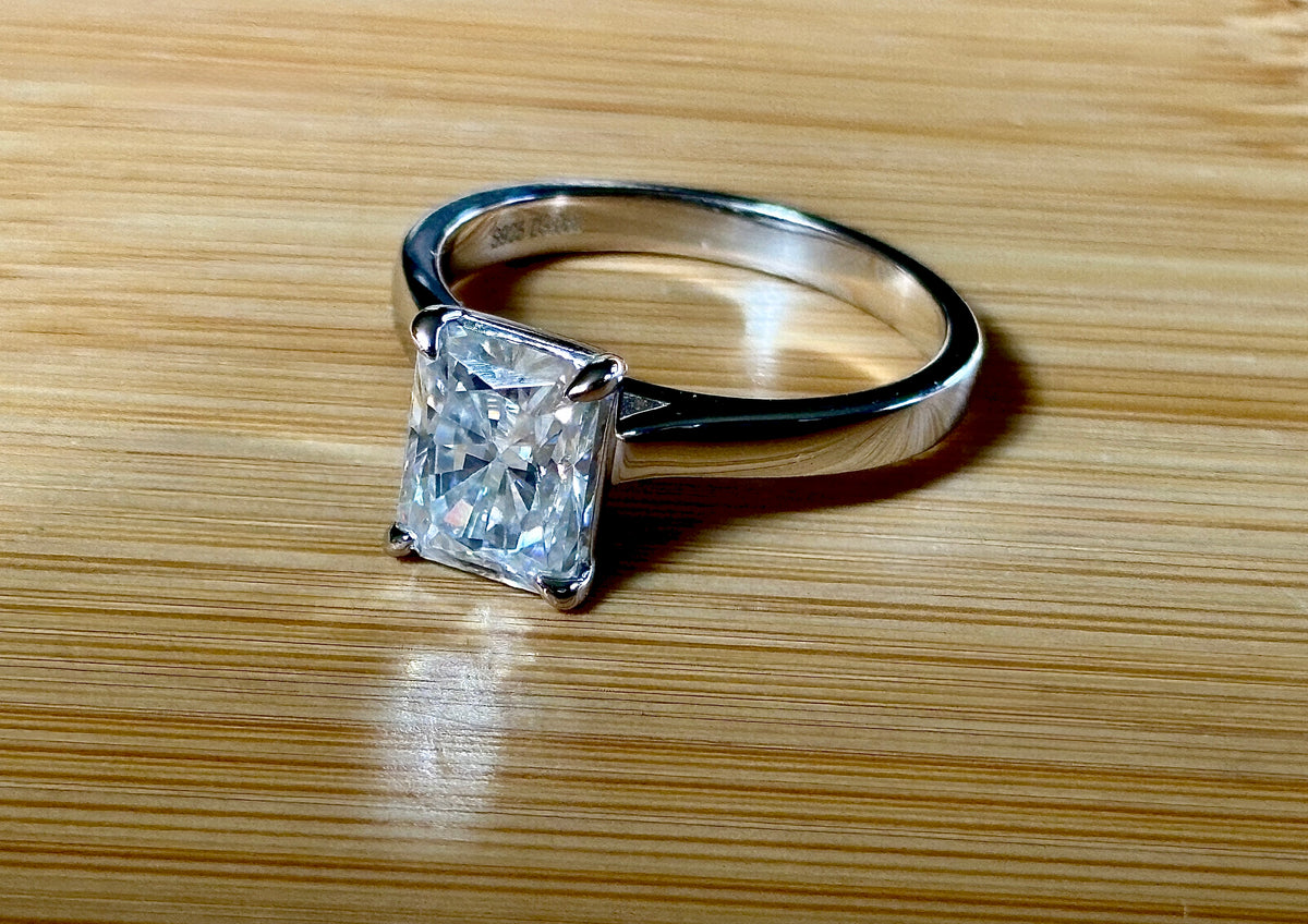 A certified Moissanite 3ct radiant solitaire! An UBER flashy, ULTRA classy, contemporary and chic radiant-cut engagement ring!