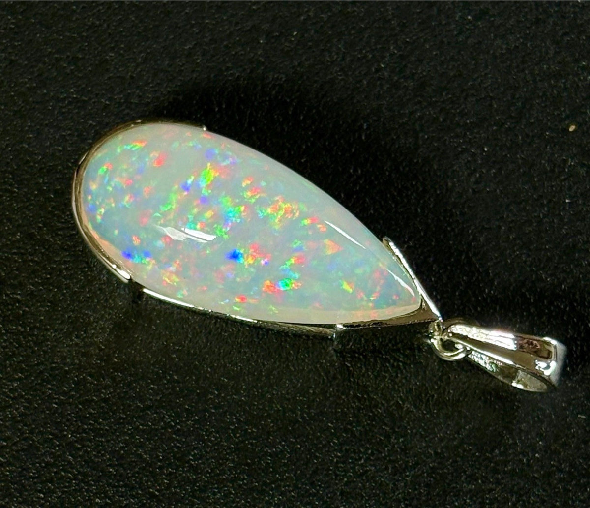 A GORGEOUS 11.05ct AAA+ grade Ethiopian pendant, an elongated pear-shaped cabochon with galaxy pattern fire and phenomenal play of color!