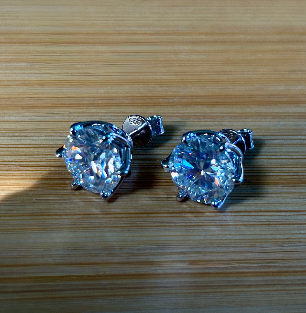 A 10ctw pair of double certified Moissanite studs in lotus-shaped sterling silver baskets!