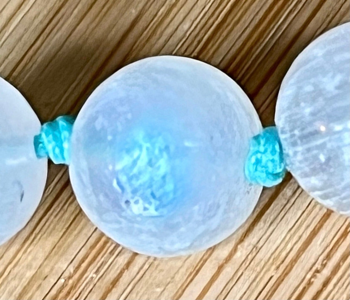 Rainbow moonstone bracelet, hand knotted with high quality 9-10mm beads! The solid sterling silver moonstone pendant is *optional*.