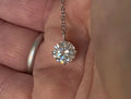 2ct Moissanite solitaire necklace. A 2ct “Floating Moissanite” in sterling silver creates the illusion of being suspended by nothing more than spider silk!