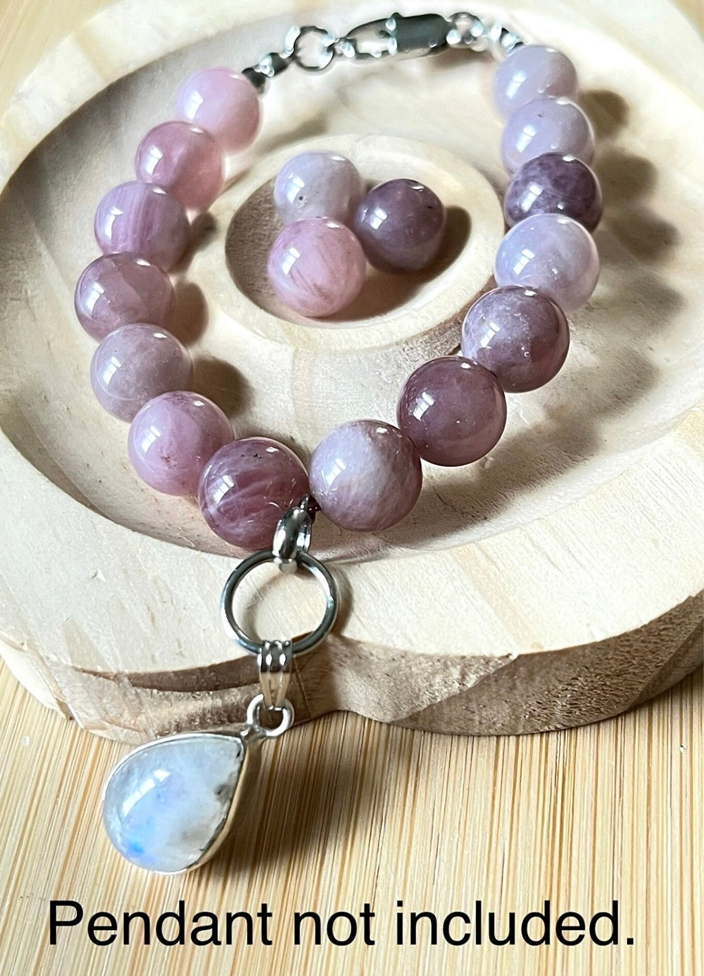 Madagascar rose quartz bracelet. Hands-down GORGEOUS AAA-grade 10.5mm purple-pink rose quartz beads and with varying degrees of crystallization and color!