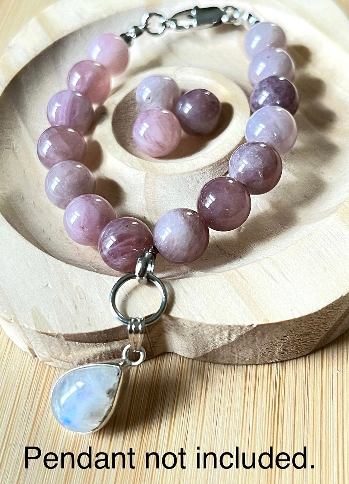 Madagascar rose quartz bracelet. Hands-down GORGEOUS AAA-grade 10.5mm purple-pink rose quartz beads and with varying degrees of crystallization and color!