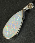 A GORGEOUS 11.05ct AAA+ grade Ethiopian pendant, an elongated pear-shaped cabochon with galaxy pattern fire and phenomenal play of color!