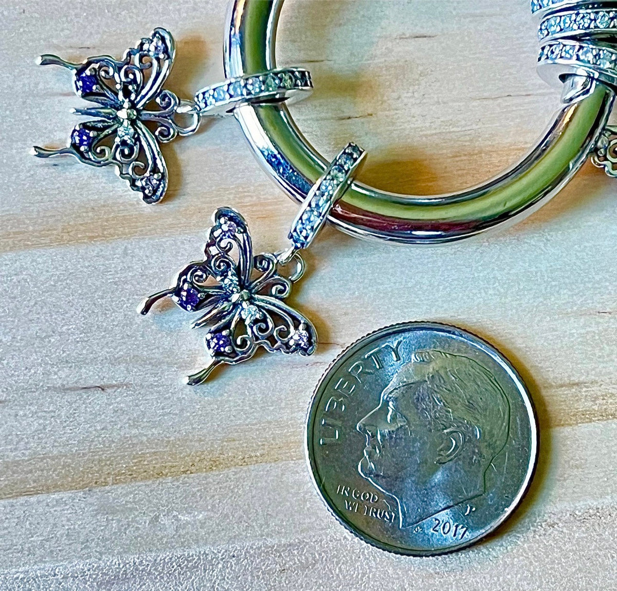 Butterfly charm, flower charm and fleur de lis charm! All solid sterling silver charms!