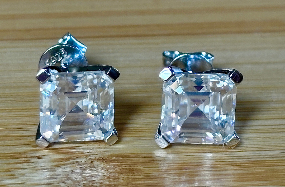 Moissanite studs. A 6.4ctw *perfect* pair of DOUBLE certified Asscher-cut Moissanites in my custom 4-claw 935 ARGENTIUM silver mountings! Opulent!