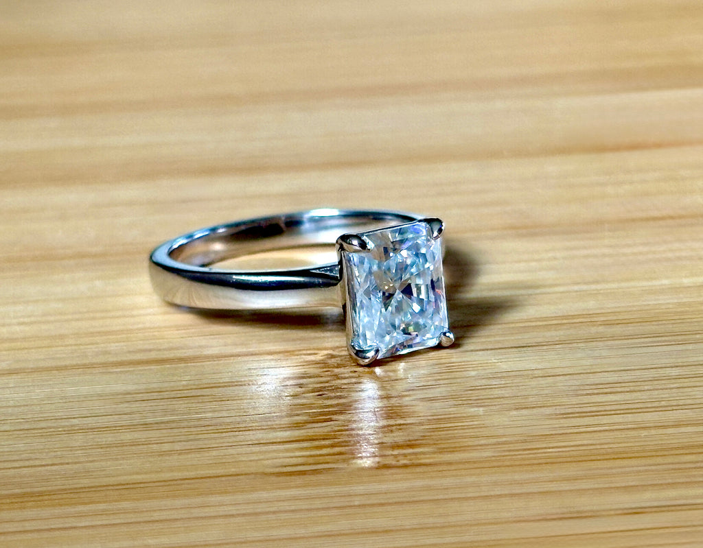 A certified Moissanite 3ct radiant solitaire! An UBER flashy, ULTRA classy, contemporary and chic radiant-cut engagement ring!
