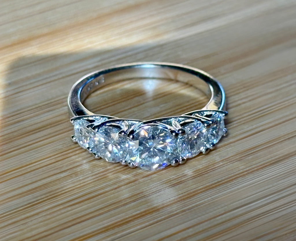 Moissanite ring. A 2.5ctw certified Moissanite ring, for those who want plenty of sparkle but a daintier ring! This feminine 5-stone design is just the thing!