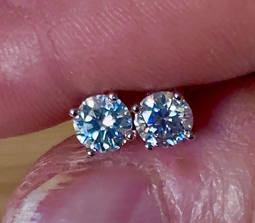 1cttw DOUBLE certified Moissanite studs with D-color and VVS1 clarity! Set in sterling silver bathed in 18k white gold, they’re a cut above!