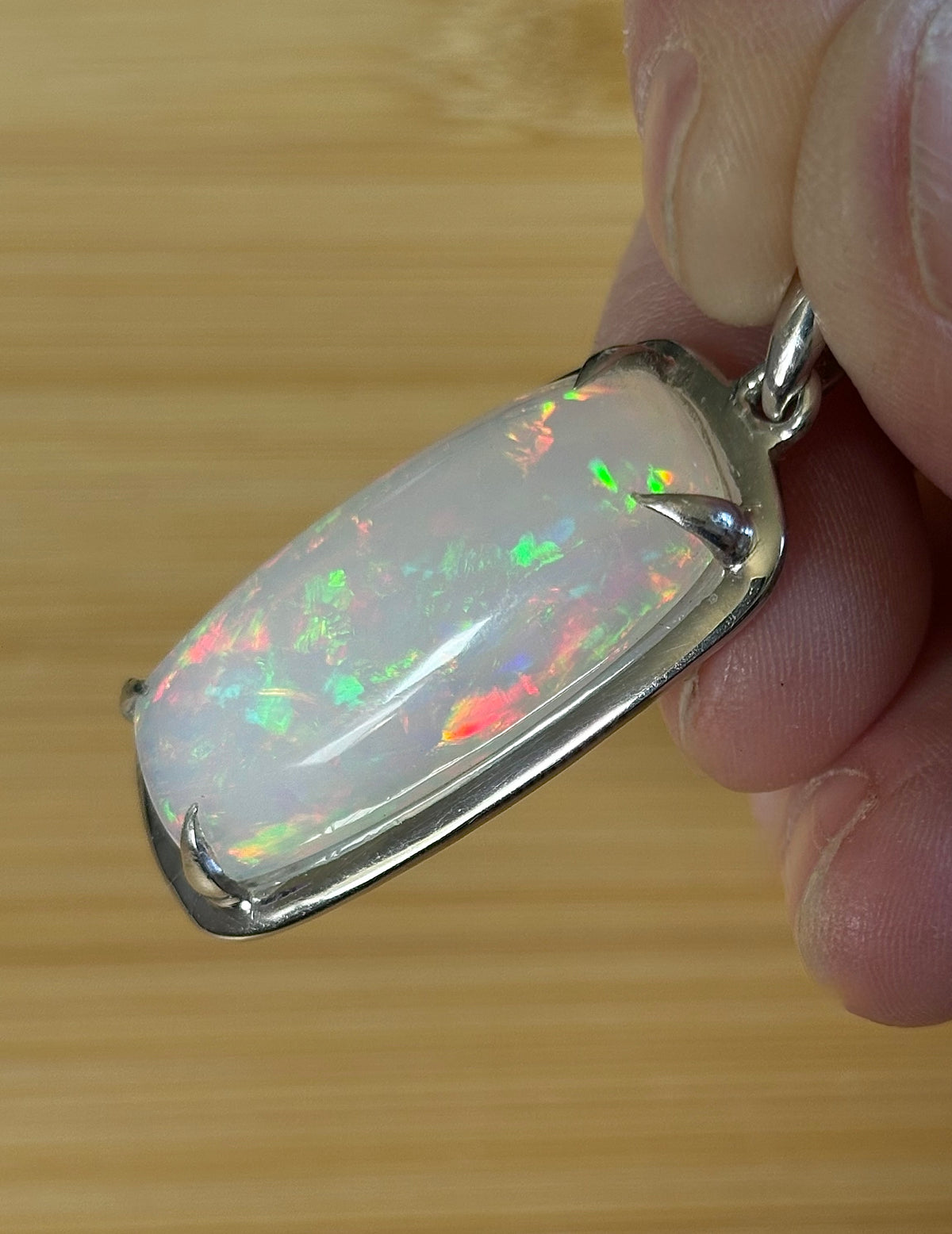 A 21ct AAA grade Ethiopian opal pendant, a handpicked opal and exclusive HKJ design! This lovely opal has gorgeous fire and play of color!