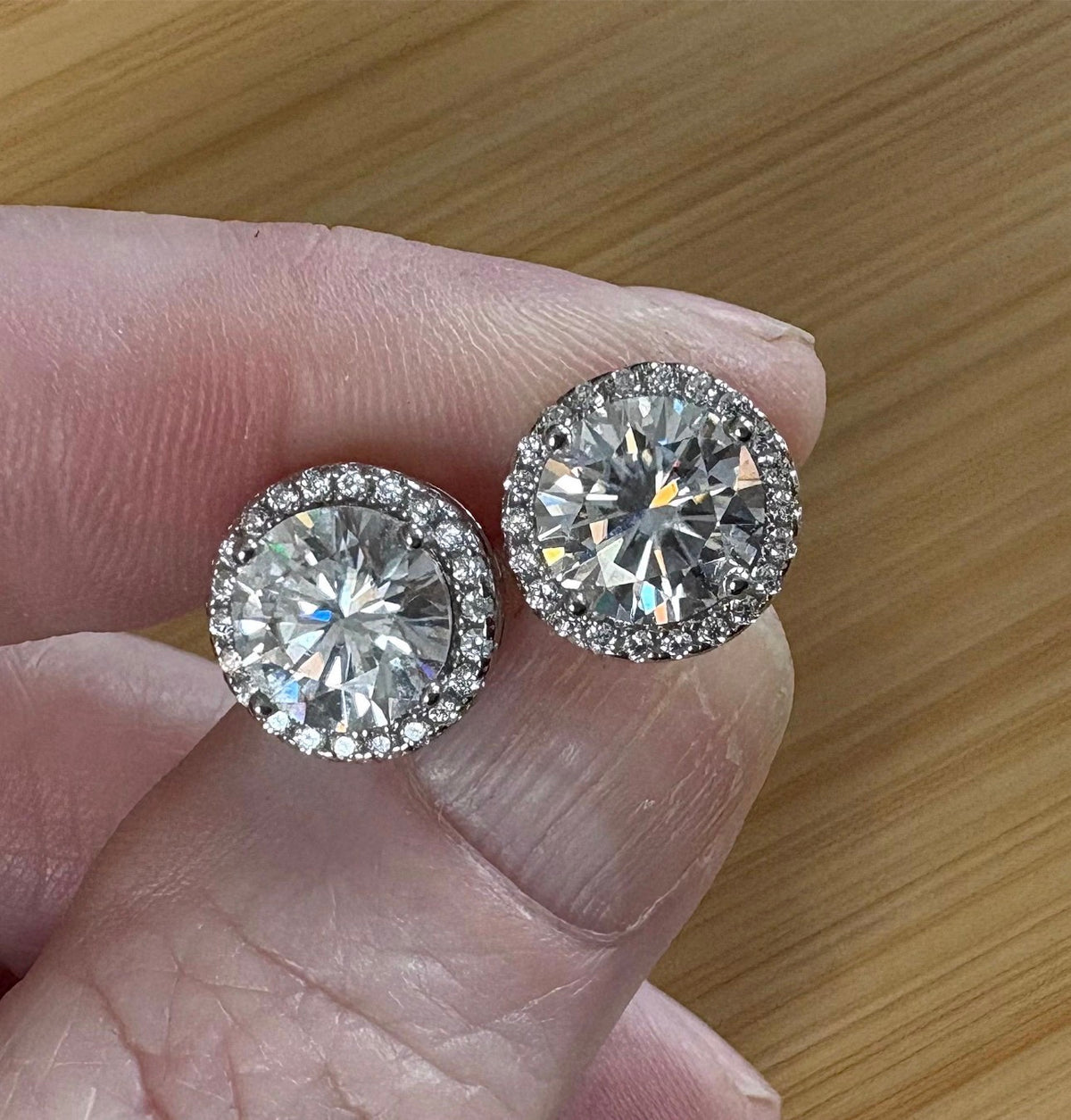 Moissanite earrings. A glittering 5.44cttw pair of certified Moissanites and white zircons in 18k gold-embraced sterling silver! Perfection!