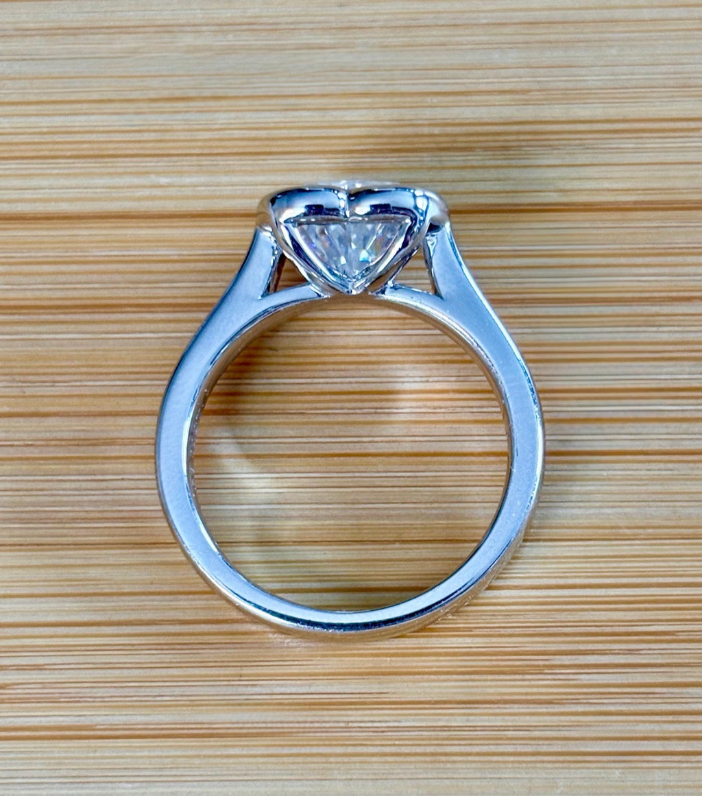 Moissanite ring. A high-end solitaire with a certified 3ct heart-cut stone, bezel-set in a heavy sterling silver mounting and bathed in 18k!