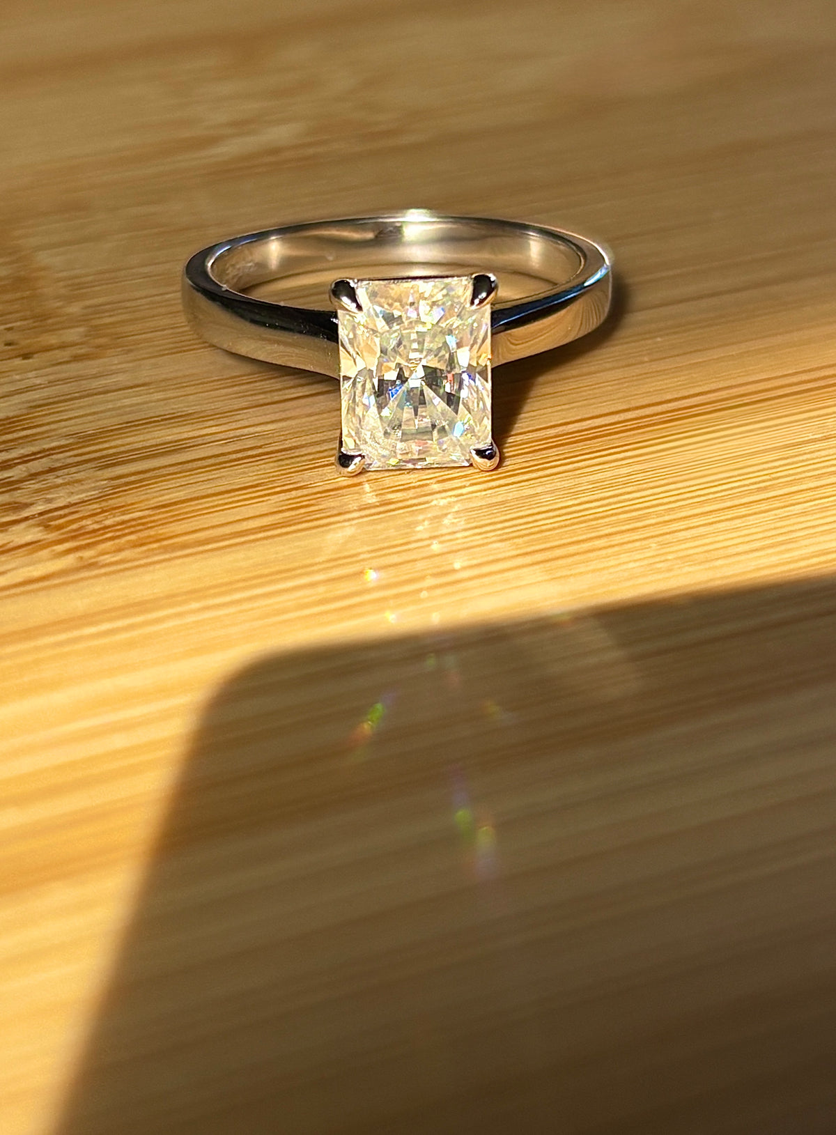 A certified Moissanite 3ct radiant solitaire! An UBER flashy, ULTRA classy, contemporary and chic radiant-cut engagement ring!