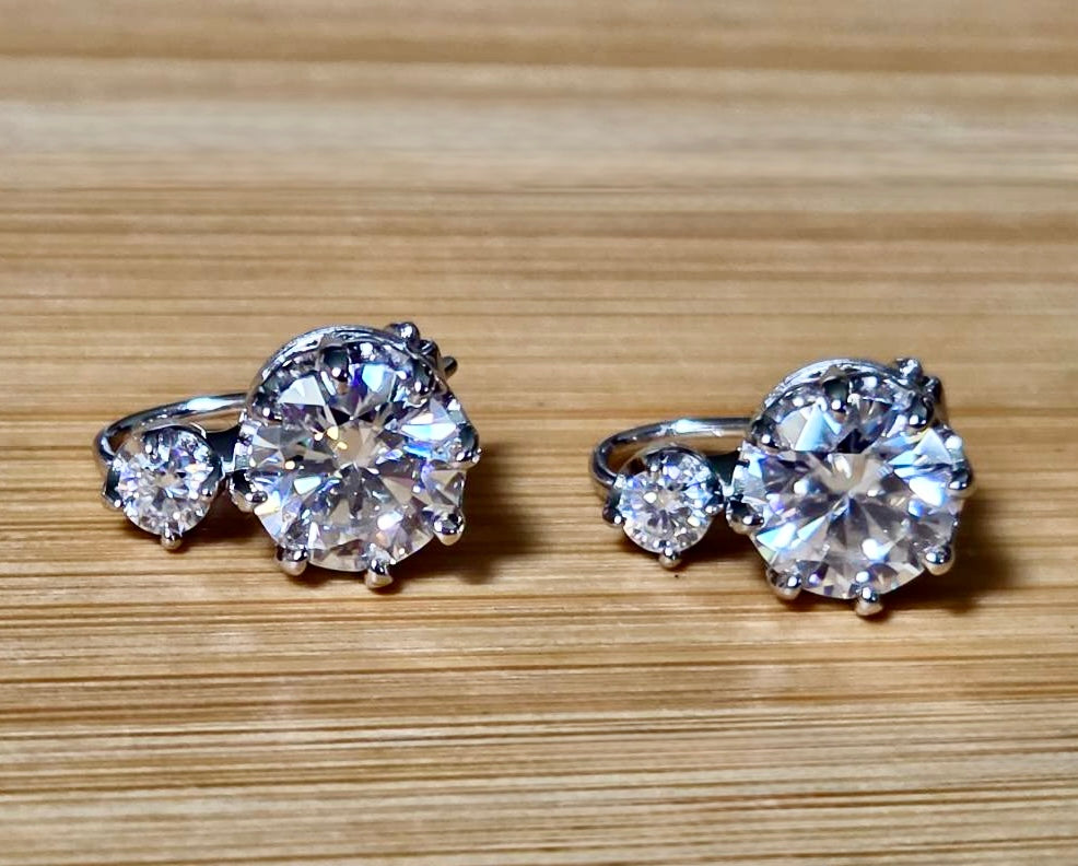A Victorian inspired 4.2cttw certified pair of Moissanite 2-stone buckle back earrings in Argentium silver! Minimalist glam!