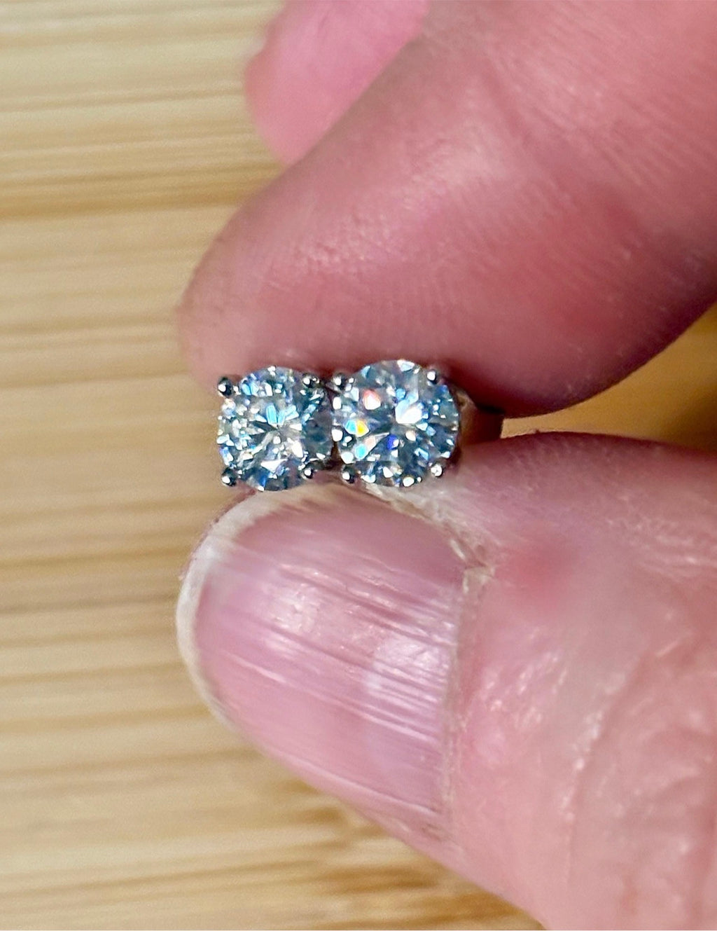 1cttw DOUBLE certified Moissanite studs with D-color and VVS1 clarity! Set in sterling silver bathed in 18k white gold, they’re a cut above!