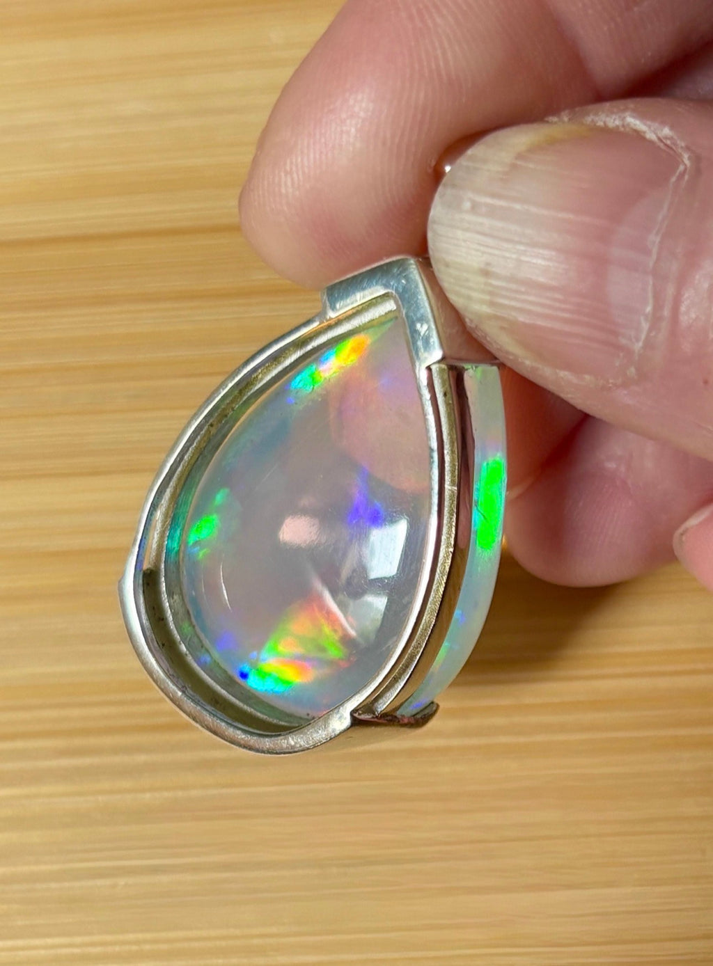 The “After the Storm” Ethiopian opal pendant, 39.18ct with rare “rolling” fire and spectacular play of color! **Collector’s grade** AAAA++