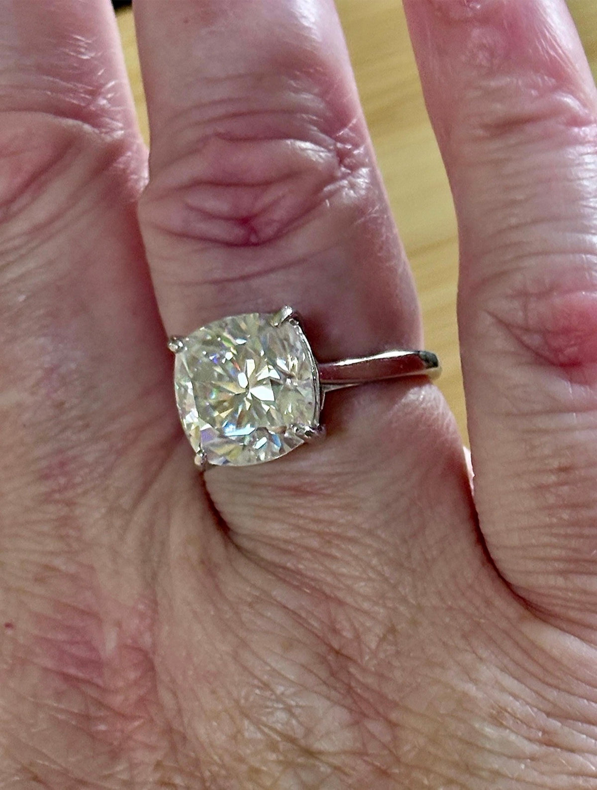 A fiery 9ct certified CLASSIC cushion-cut Moissanite solitaire, the ring of a certain princess (ex-princess?), but without the royal price tag! So indulge!