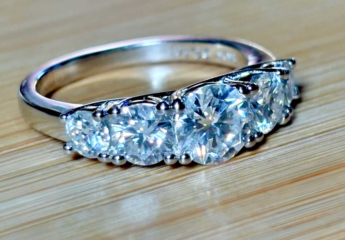 Moissanite ring. A 2.5ctw certified Moissanite ring, for those who want plenty of sparkle but a daintier ring! This feminine 5-stone design is just the thing!