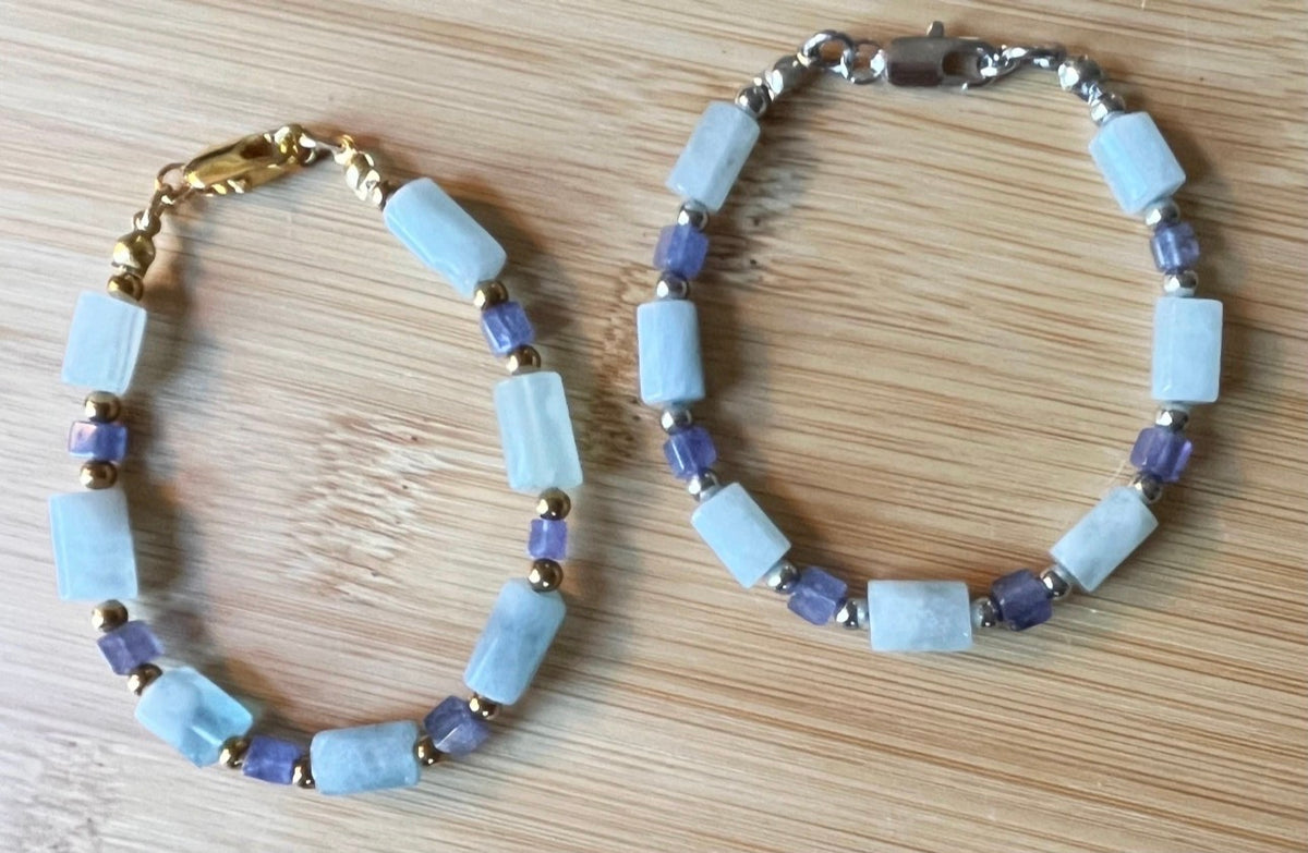Aquamarine and tanzanite bracelet. The “True Blue” bracelet features trendy aquamarine barrels and dusky tanzanite cubes!