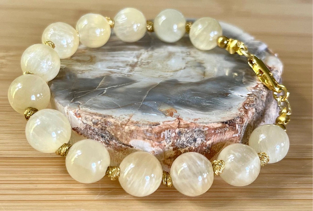 Silky yellow quartz bracelet. Chatoyant 10mm buttercream quartzite (AKA silk jade) hand-knotted bracelet with METALLIC string!