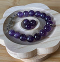 Amethyst bracelet. Natural and vibrant 10mm amethyst beads and stainless steel! The amethyst pendant in solid sterling silver is optional.
