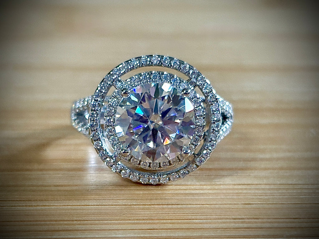 Moissanite ring. The 6.64cttw *fully* Moissanite “Bull’s Eye” ring, featuring a 4ct certified round brilliant Moissanite in a double halo!