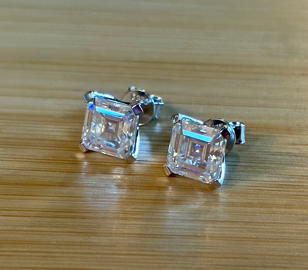 Moissanite studs. A 6.4ctw *perfect* pair of DOUBLE certified Asscher-cut Moissanites in my custom 4-claw 935 ARGENTIUM silver mountings! Opulent!