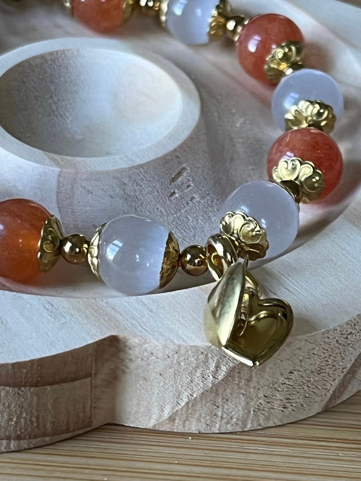 White selenite and tangerine chalcedony bracelet with raw brass and stainless steel components. The functioning brass locket is included!