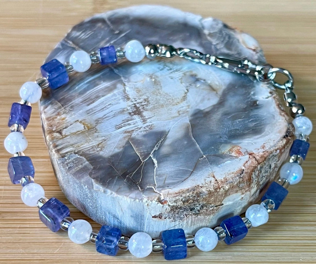 Moonstone and tanzanite bracelet. Dusky tanzanite cubes and round moonstones on stainless steel jeweler’s wire! Pretty and petite!