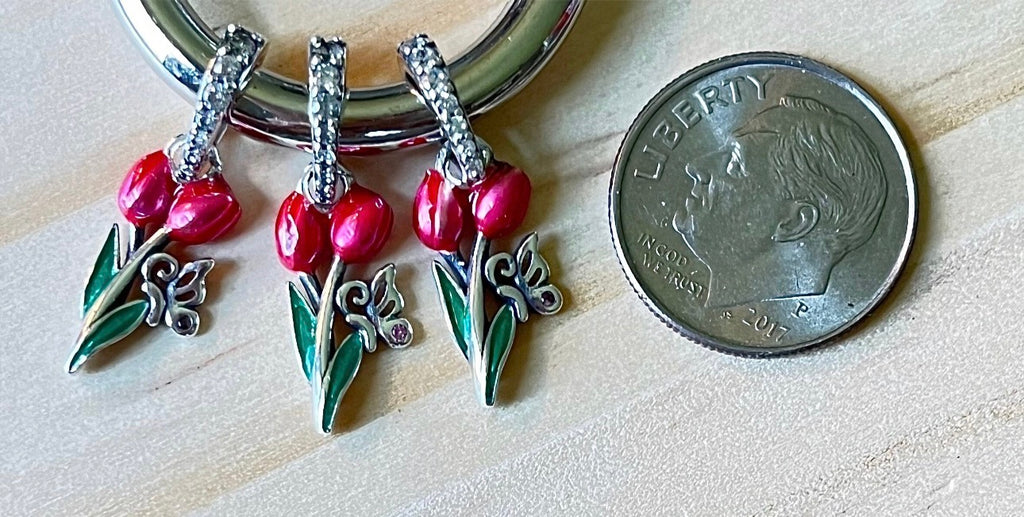 Butterfly charm, flower charm and fleur de lis charm! All solid sterling silver charms!