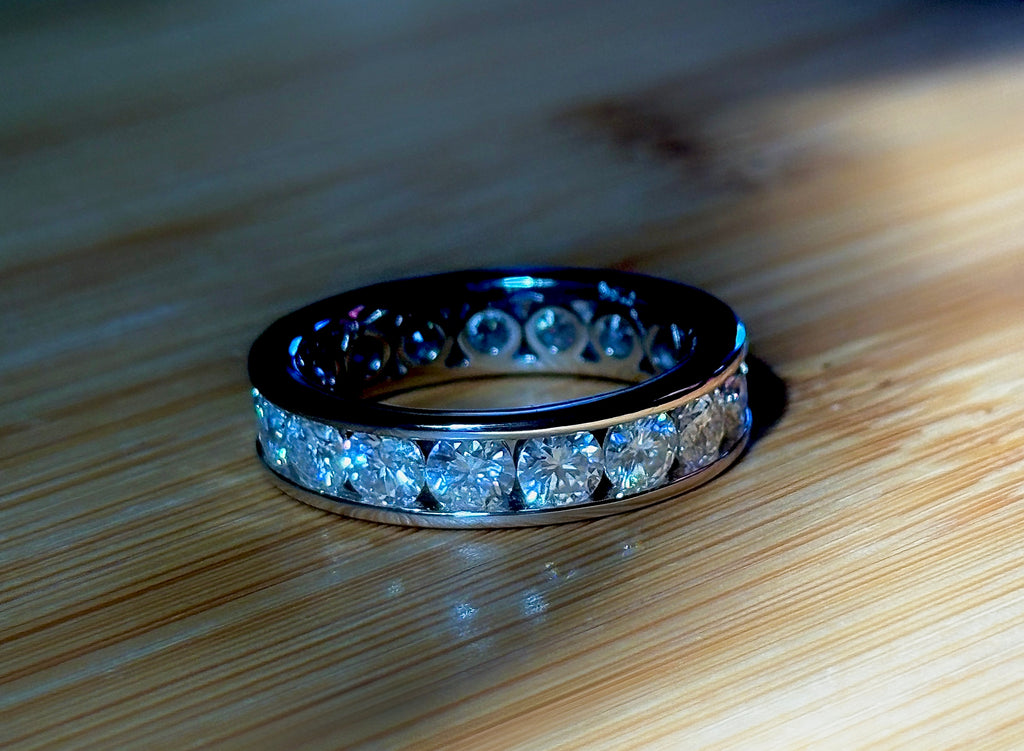 Moissanite ring. A 5.10cttw or 4.8cttw (depending on size) Moissanite eternity ring. A channel-set, classy and classic design - beautiful!