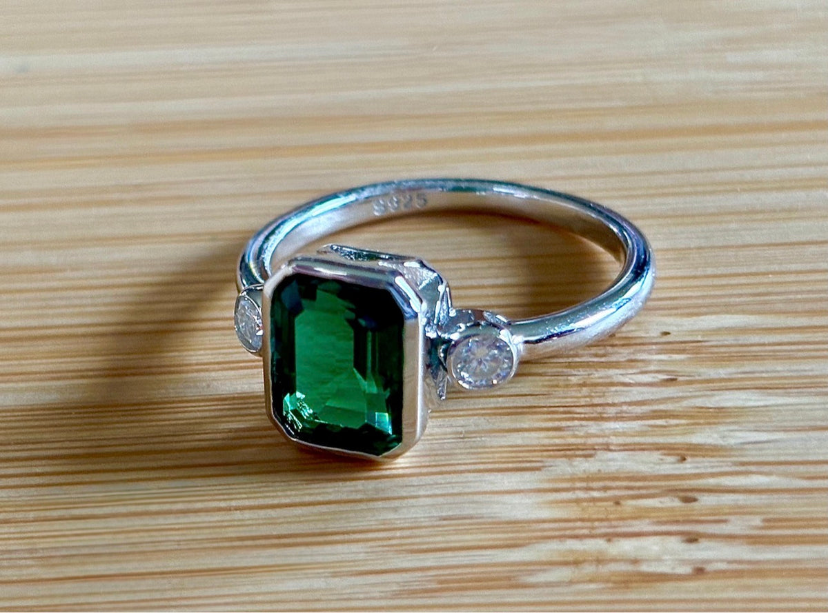 Emerald and Moissanite ring. A certified 2ct lab-grown emerald-cut Zambian emerald and .20cttw Moissanite ring! Exclusive to my shop!