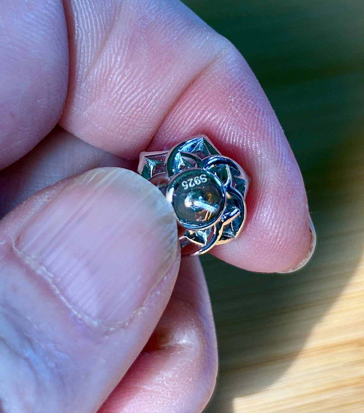 A 10ctw pair of double certified Moissanite studs in lotus-shaped sterling silver baskets!
