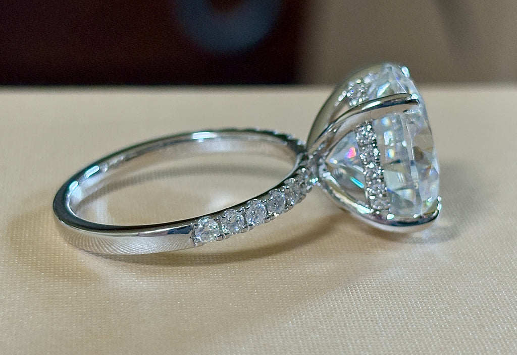 Moissanite solitaire. A glorious 10ct 8H8A Moissanite in a 4-prong mounting with a Moissanite “hidden halo” and shoulders, an 11.3cttw ring!