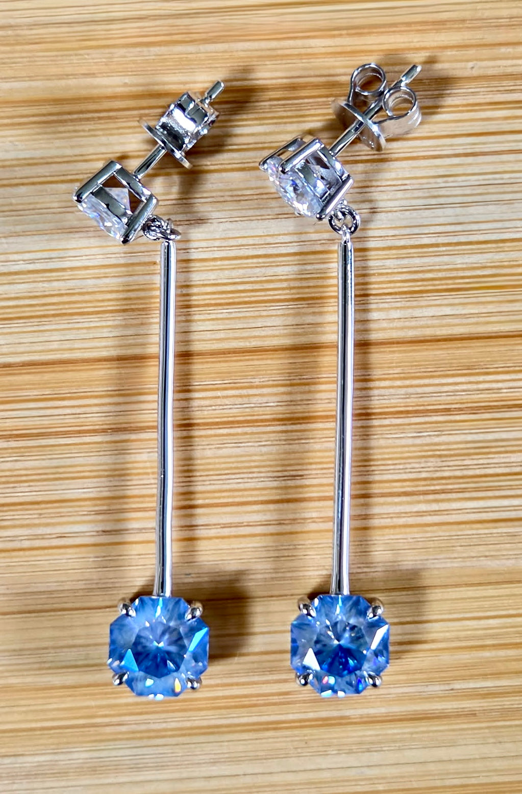 8ctw Moissanite pendulum earrings, with 3ct octagonal frosty aquamarine Moissanites at the bottom of the pendulum, and 1ct white round brilliant Moissanites at the top! Full Argentium silver construction with sterling silver disk backs! An HKJ exclusive!