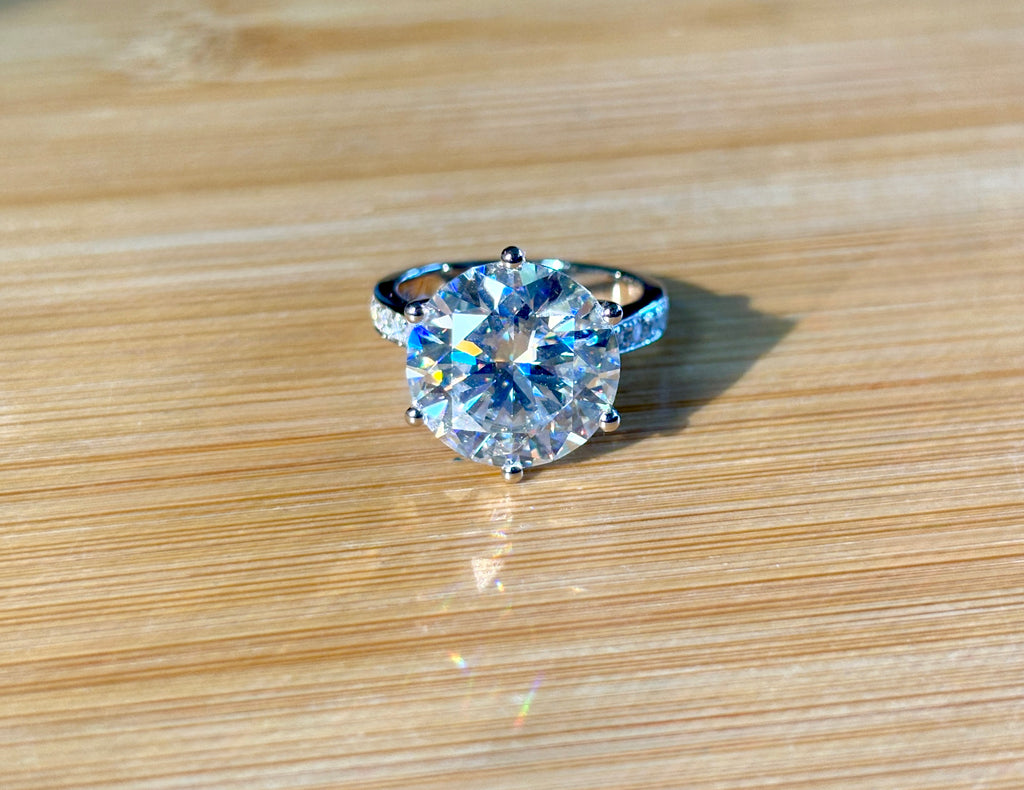 Moissanite ring. The 10ct certified 8H8A Moissanite “Tulip” statement ring with .50cttw Moissanite accents! Photos fail this GORGEOUS ring!
