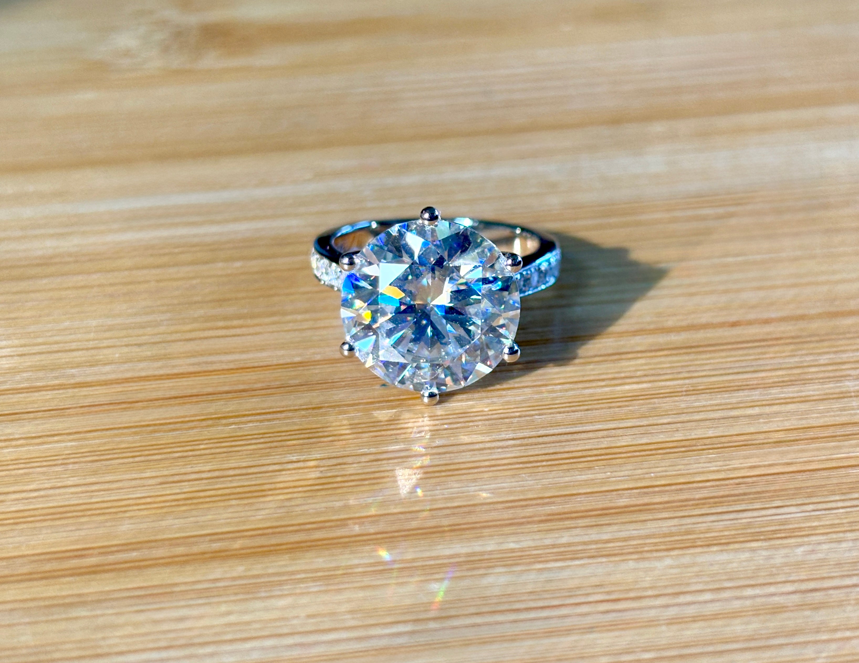 Moissanite ring. The 10ct certified 8H8A Moissanite “Tulip” statement ring with .50cttw Moissanite accents! Photos fail this GORGEOUS ring!