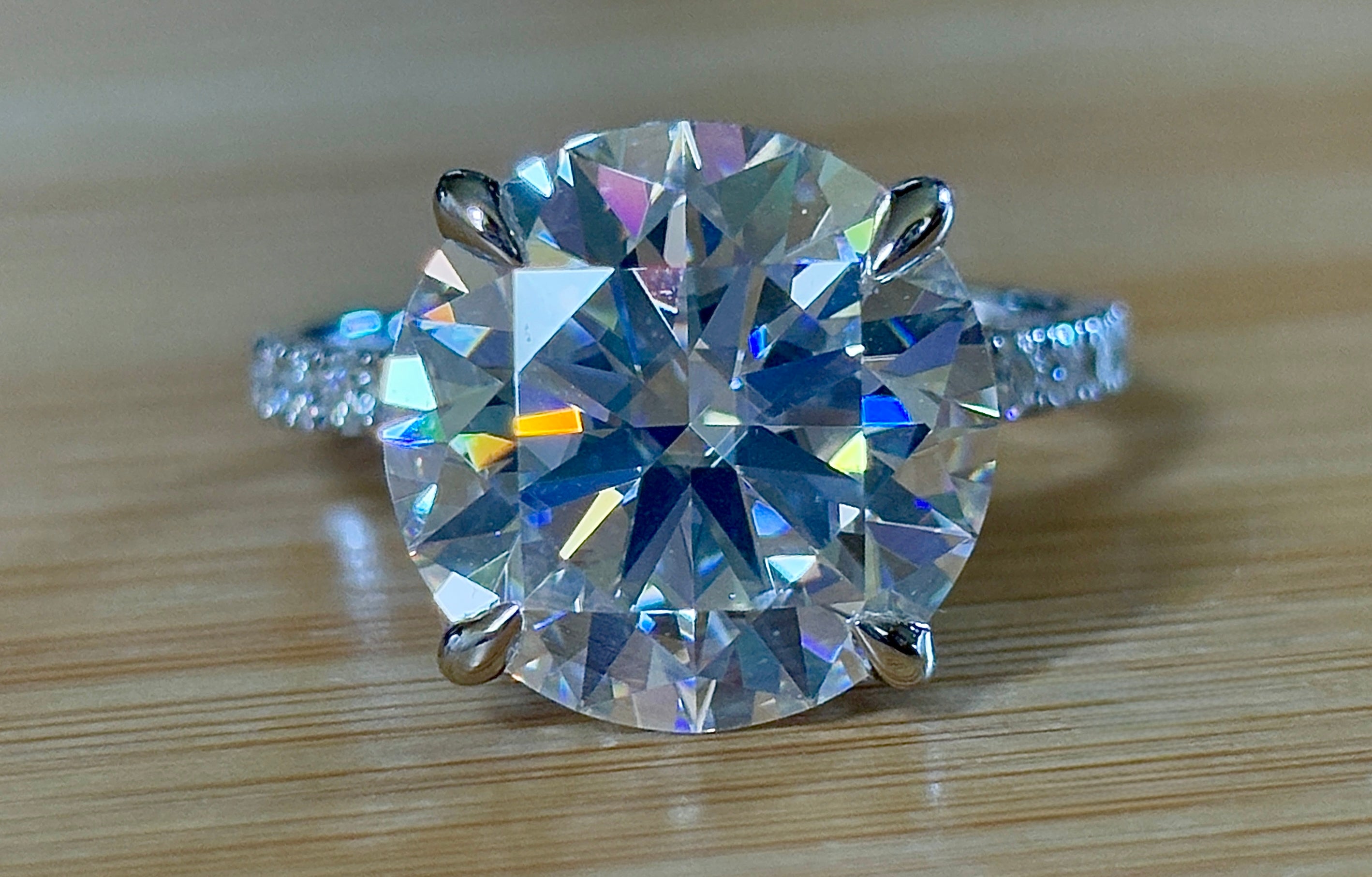 Moissanite solitaire. A glorious 10ct 8H8A Moissanite in a 4-prong mounting with a Moissanite “hidden halo” and shoulders, an 11.3cttw ring!