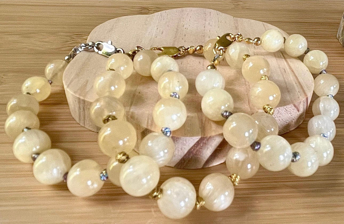 Silky yellow quartz bracelet. Chatoyant 10mm buttercream quartzite (AKA silk jade) hand-knotted bracelet with METALLIC string!