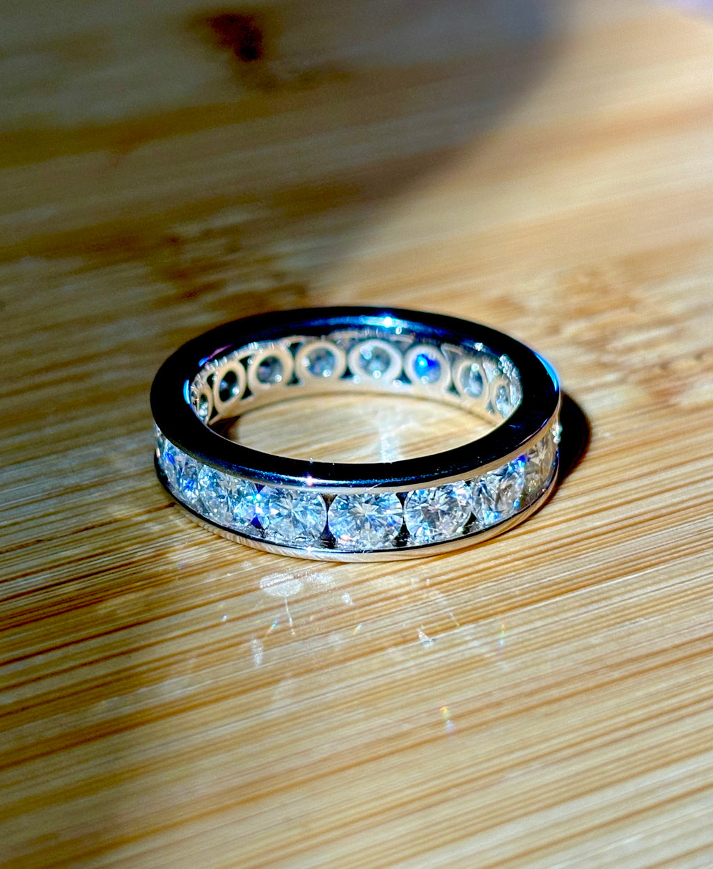 Moissanite ring. A 5.10cttw or 4.8cttw (depending on size) Moissanite eternity ring. A channel-set, classy and classic design - beautiful!