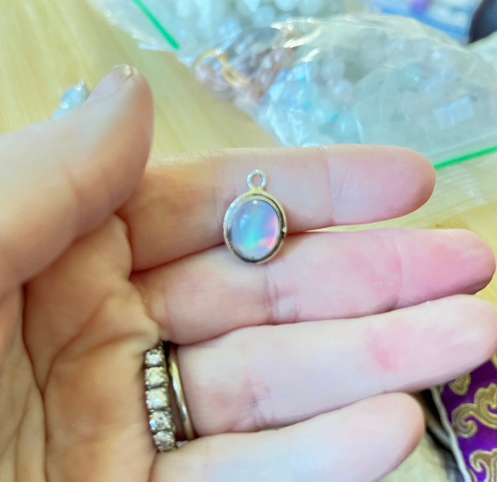 Moonstone, peach moonstone and lab “aurora” opal pendants in sterling silver!