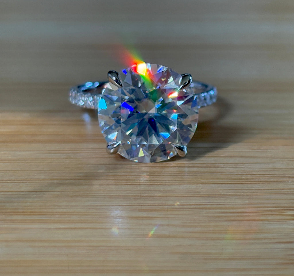 Moissanite solitaire. A glorious 10ct 8H8A Moissanite in a 4-prong mounting with a Moissanite “hidden halo” and shoulders, an 11.3cttw ring!