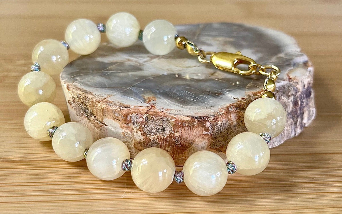 Silky yellow quartz bracelet. Chatoyant 10mm buttercream quartzite (AKA silk jade) hand-knotted bracelet with METALLIC string!