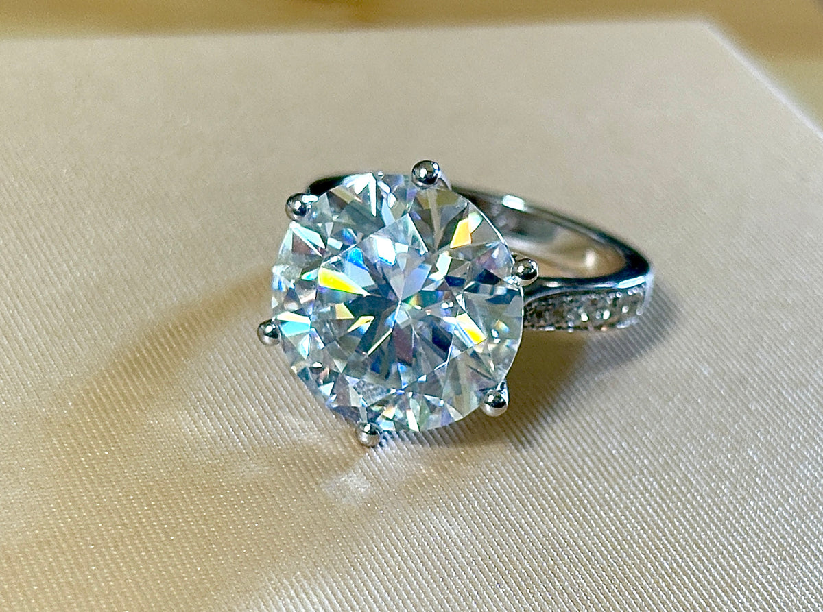 Moissanite ring. The 10ct certified 8H8A Moissanite “Tulip” statement ring with .50cttw Moissanite accents! Photos fail this GORGEOUS ring!