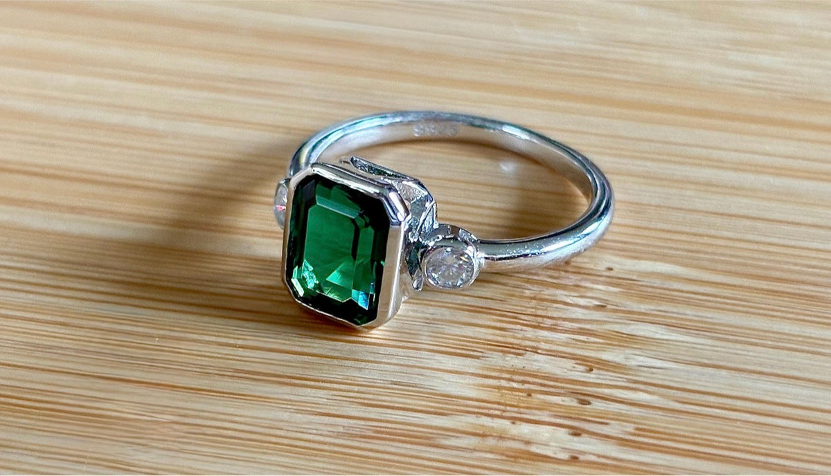 Emerald and Moissanite ring. A certified 2ct lab-grown emerald-cut Zambian emerald and .20cttw Moissanite ring! Exclusive to my shop!